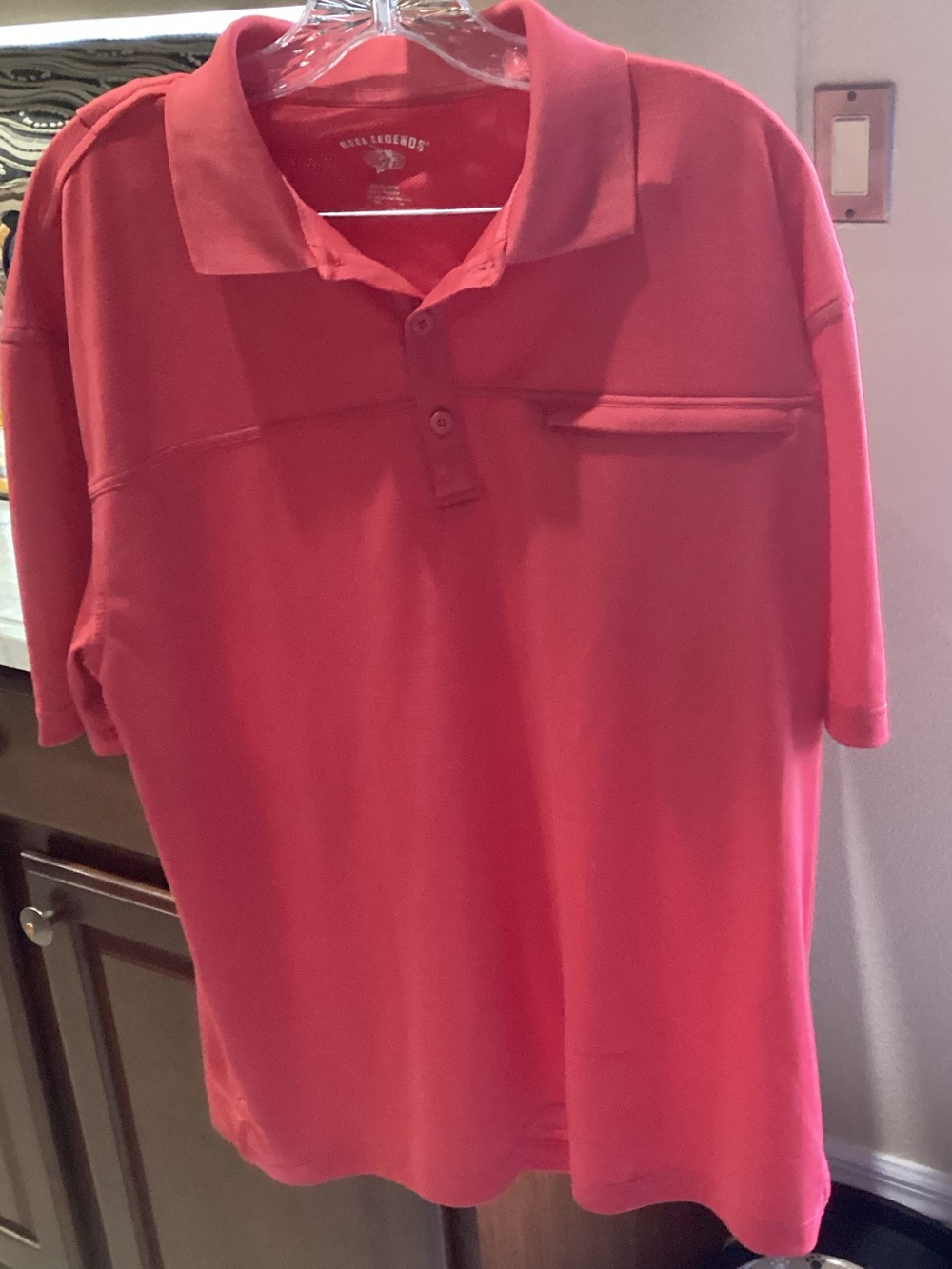 Reel Legends Rust Performance Polo with front pocket.